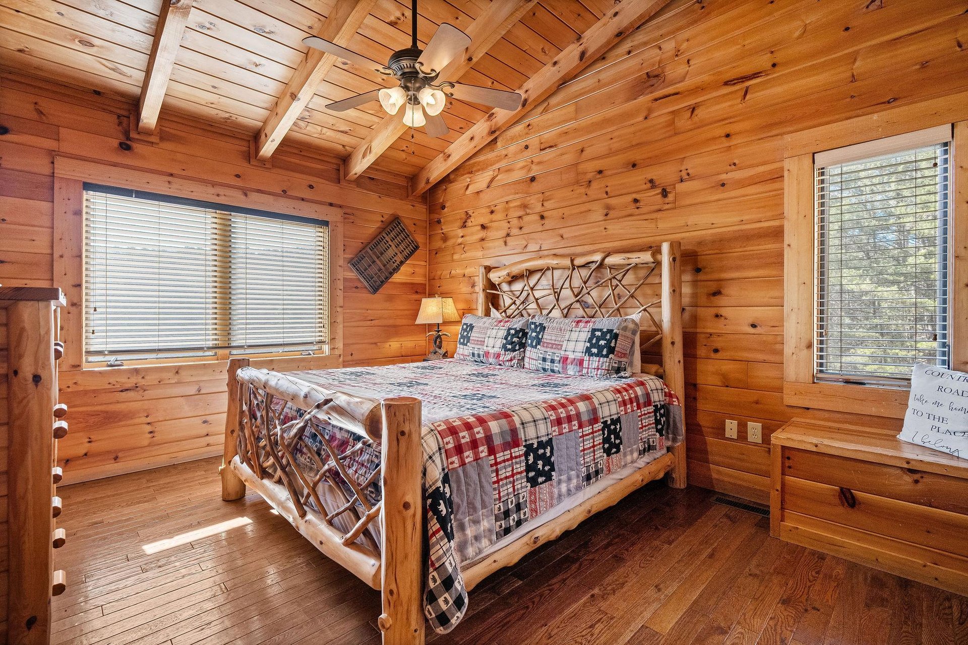 Bedroom with a wood bed at Mountain Mama, a 3 bedroom cabin rental located in Pigeon Forge