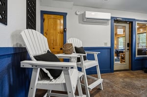 Relax in classic Adirondack chairs on your private covered porch, complete with climate control and charming nautical accents to enhance your outdoor retreat.