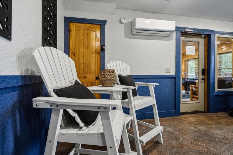Relax in classic Adirondack chairs on your private covered porch, complete with climate control and charming nautical accents to enhance your outdoor retreat.
