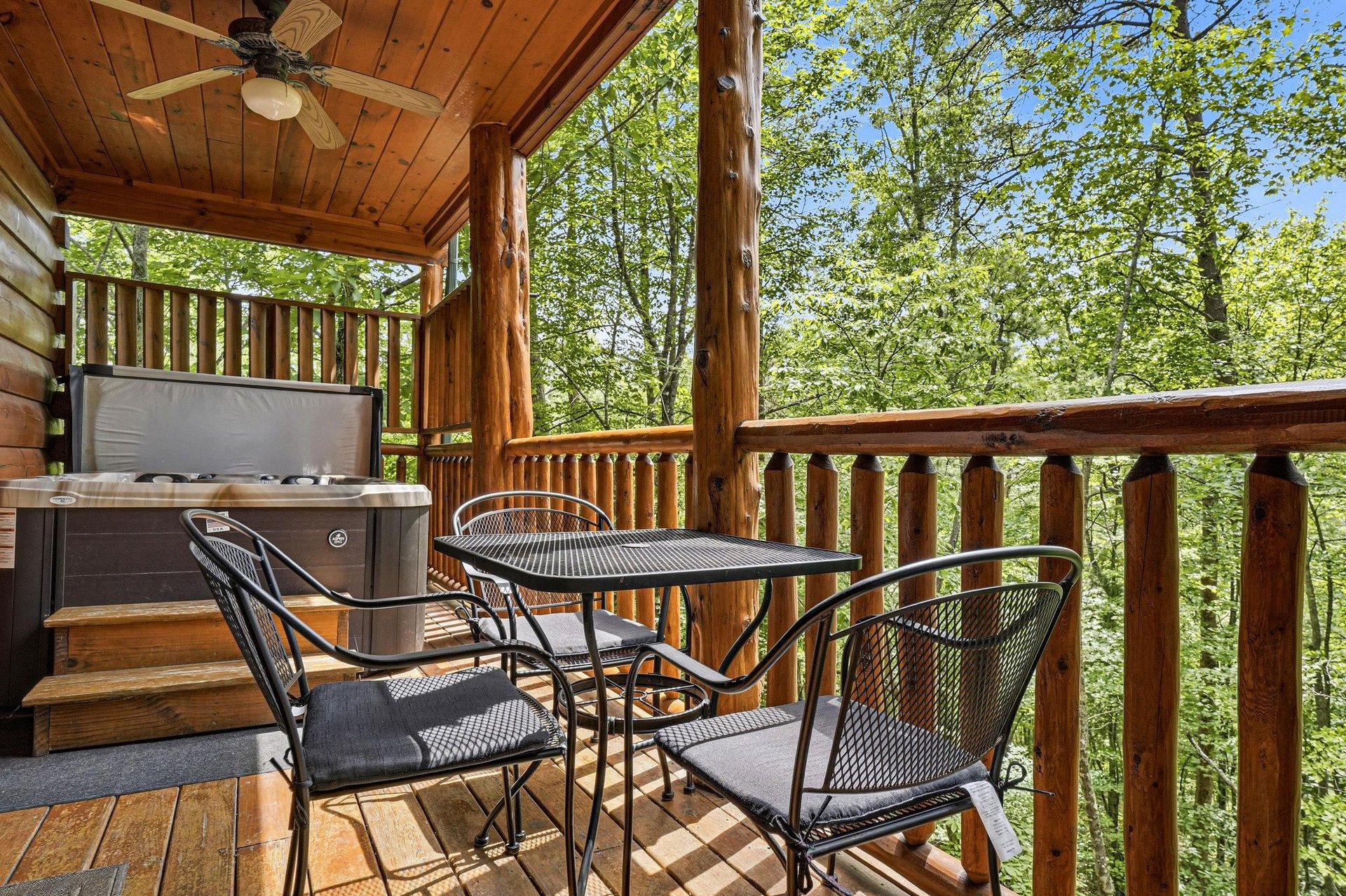 Soak in the hot tub on your covered deck, surrounded by tranquil forest views, or dine al fresco at the cozy outdoor table beneath warm wooden beams.