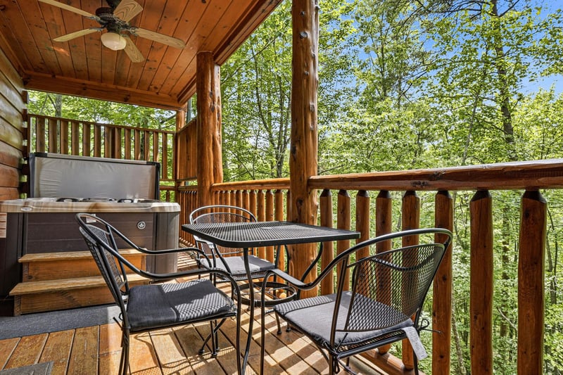 Soak in the hot tub on your covered deck, surrounded by tranquil forest views, or dine al fresco at the cozy outdoor table beneath warm wooden beams.