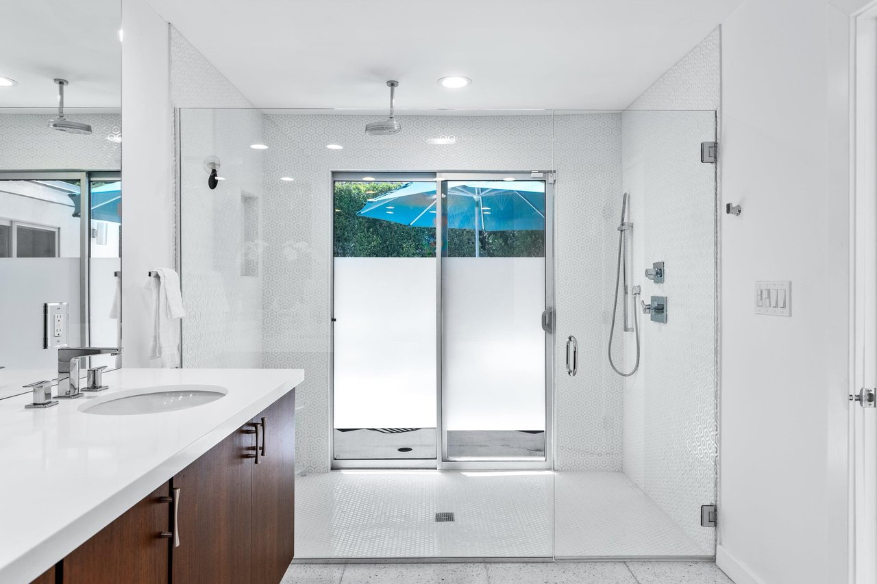 Walkin shower with rainhead shower and removable shower head.