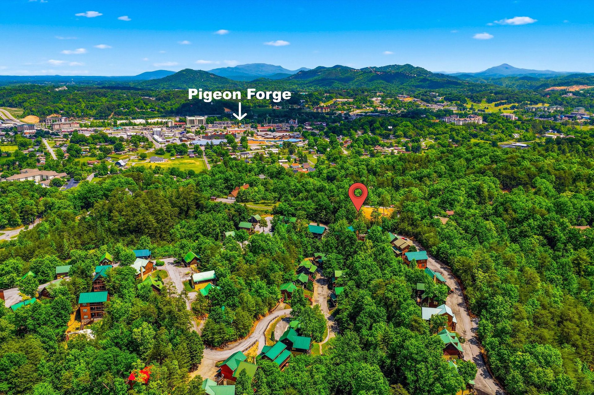 Aerial view of the property nestled in the lush Tennessee mountains near Pigeon Forge, showcasing the scenic forested setting.