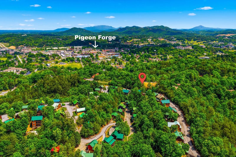 Aerial view of the property nestled in the lush Tennessee mountains near Pigeon Forge, showcasing the scenic forested setting.