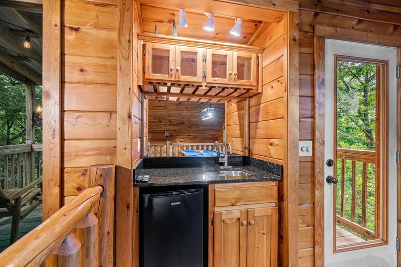mini fridge, sink and counter