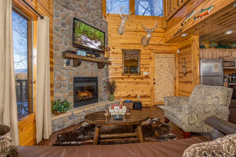 Living room with stone fireplace