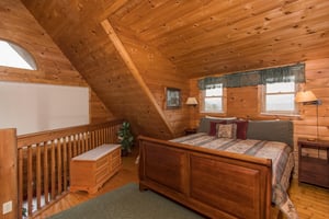 King bed in loft at Hanky Panky, a 1bedroom cabin rental located in Pigeon Forge