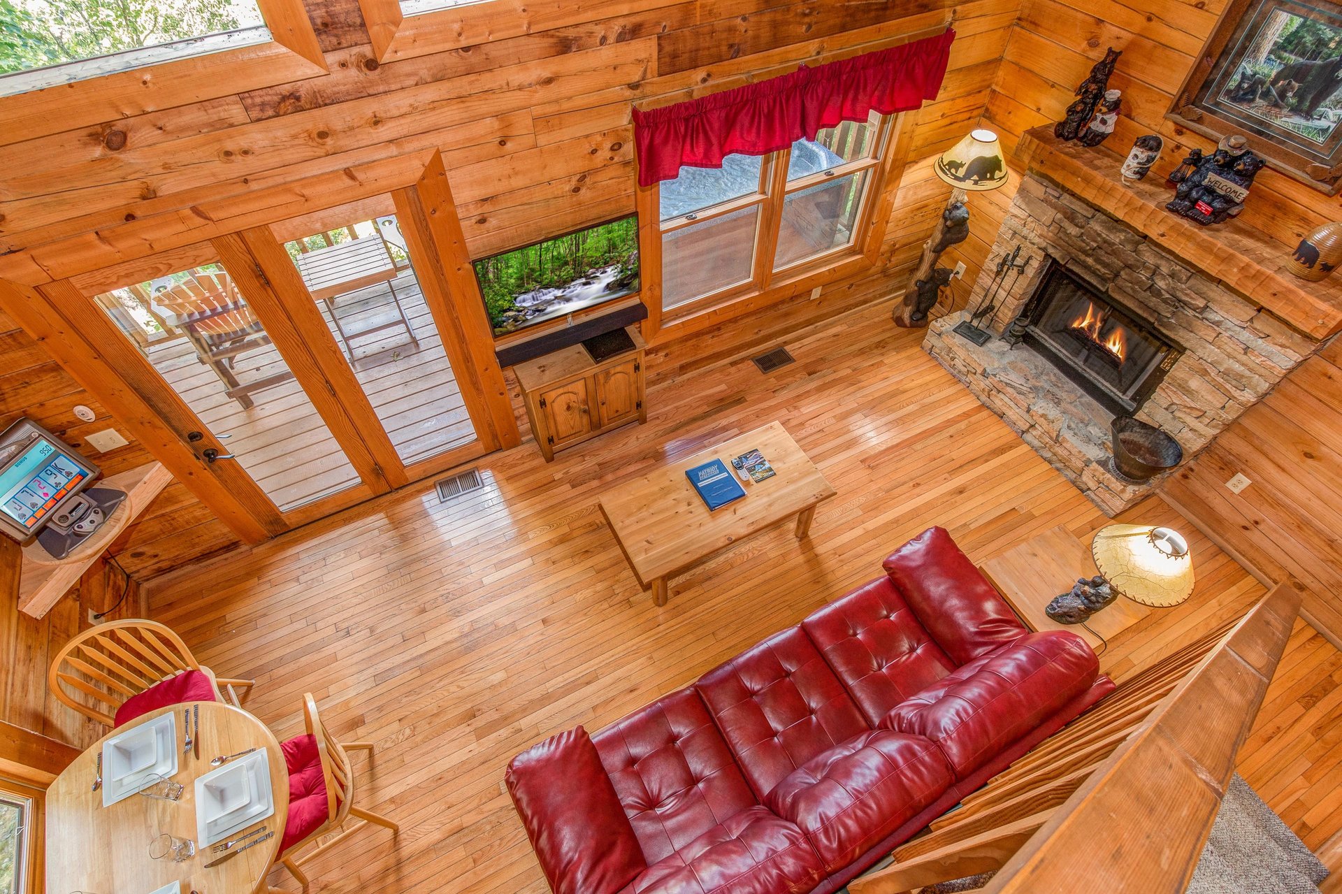 Looking down at the living room at Cupids Crossing, a 1 bedroom cabin rental located in Pigeon Forge