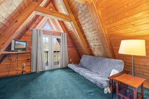 Bathroom with a tub and shower at Living on Love, a 2 bedroom cabin rental located in Pigeon Forge