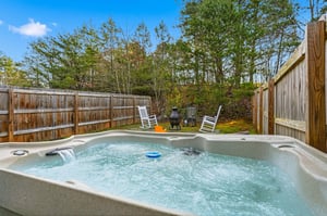 Soak your cares away in your private hot tub surrounded by towering trees and peaceful woodland views.