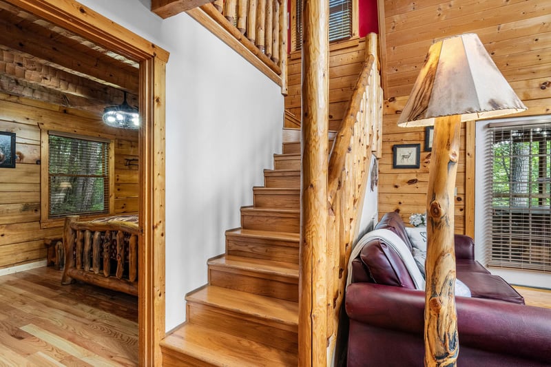 stairway entrance in living room leaving to game room