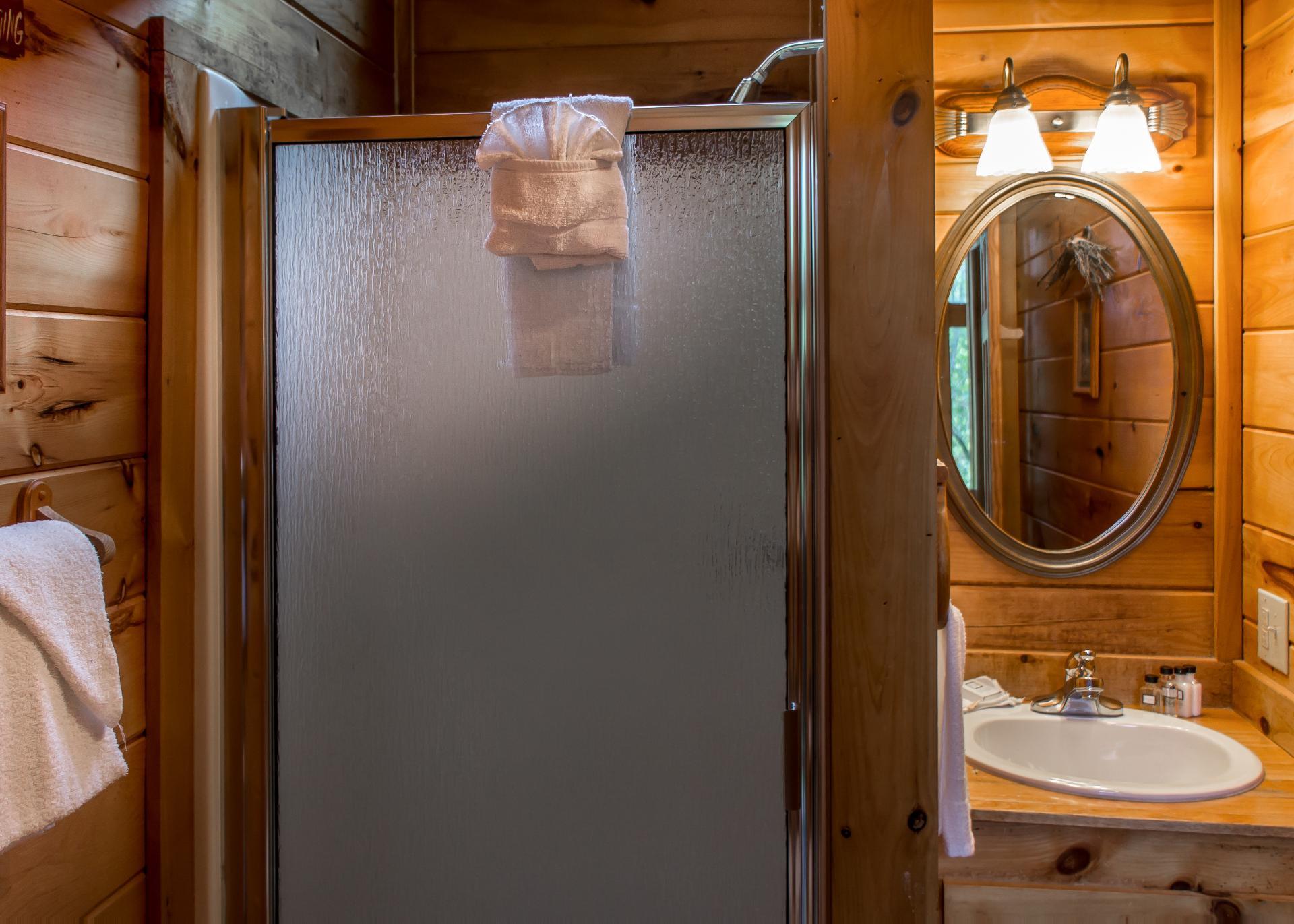 The third full bathroom is equipped with a shower stall.