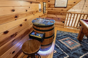 Discover your own private arcade corner with classic games in this cozy log cabin retreat.