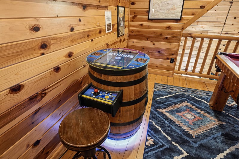 Discover your own private arcade corner with classic games in this cozy log cabin retreat.