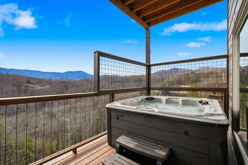 Soak in your private hot tub while gazing at stunning mountain vistas stretching endlessly before you.