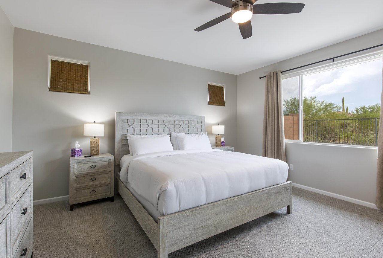 King size bed, clothing storage, ceiling fan, and ensuite bathroom.