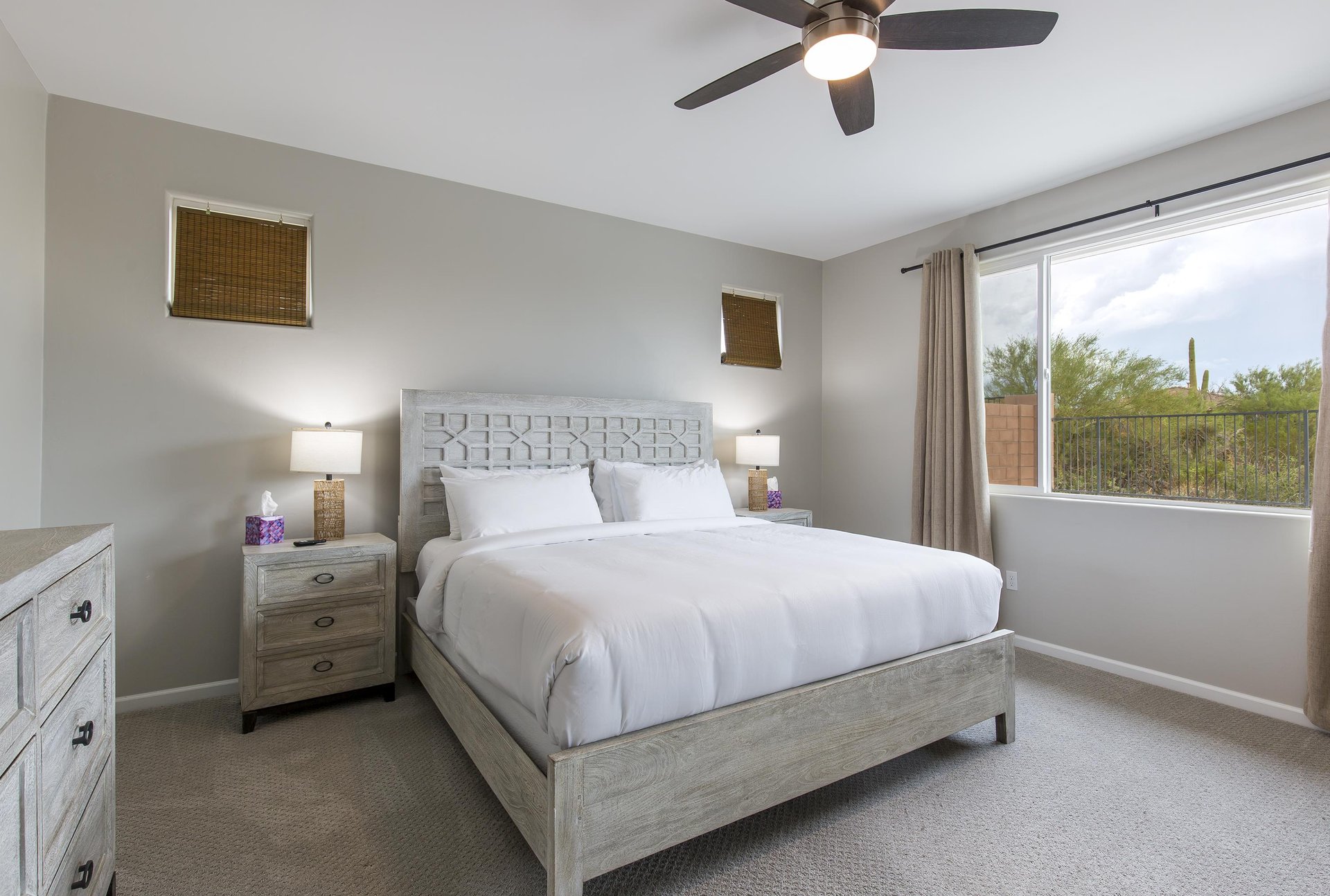 King size bed, clothing storage, ceiling fan, and ensuite bathroom.