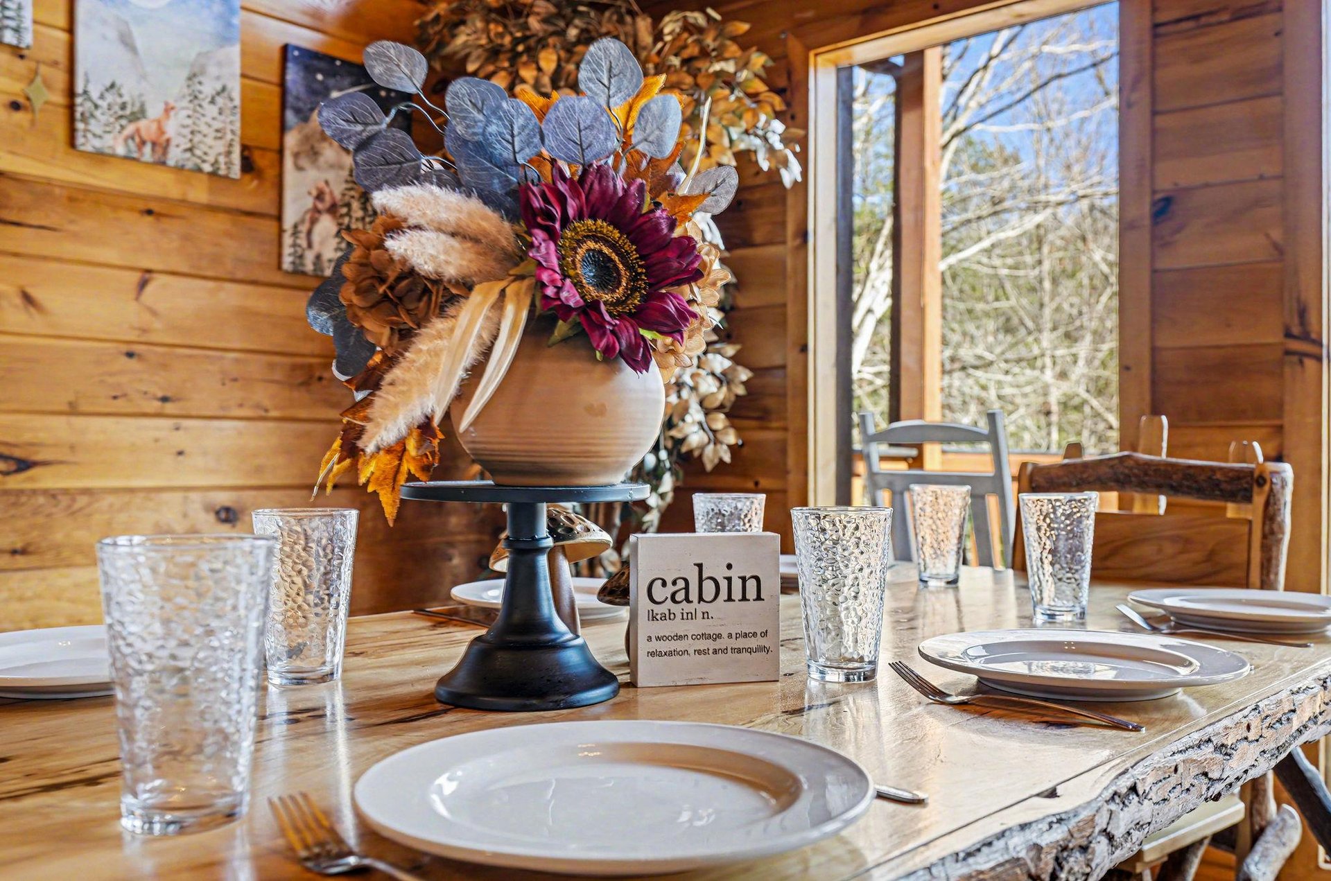 Gather around this beautifully set dining table where autumn blooms and warm wood create the perfect atmosphere for memorable meals with loved ones.