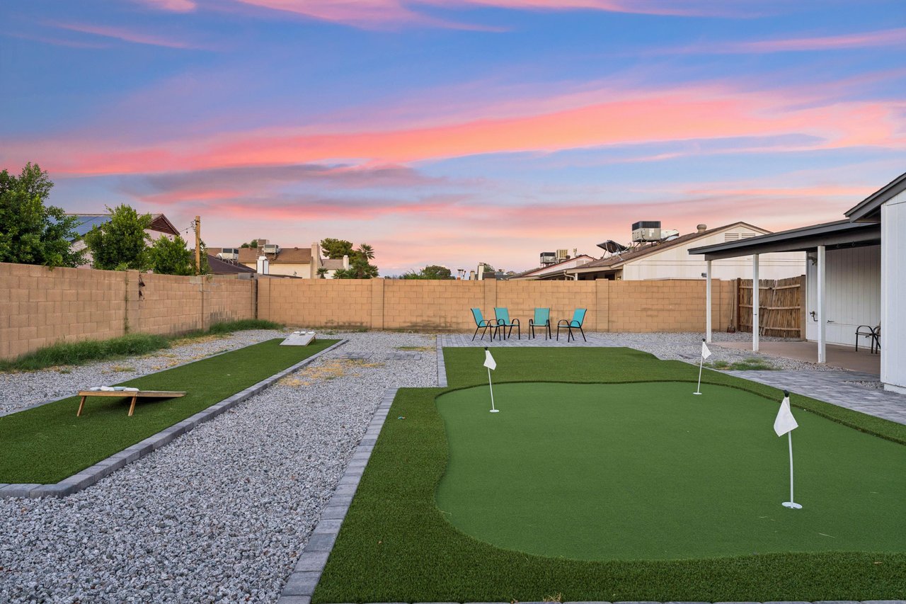 Putting green and corn hole.