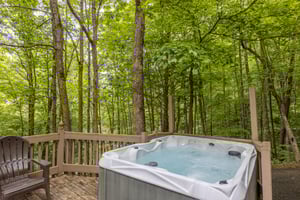 Trees surrounding the hot tub at Heavenly Hideaway, a 2bedroom cabin rental located in Gatlinburg
