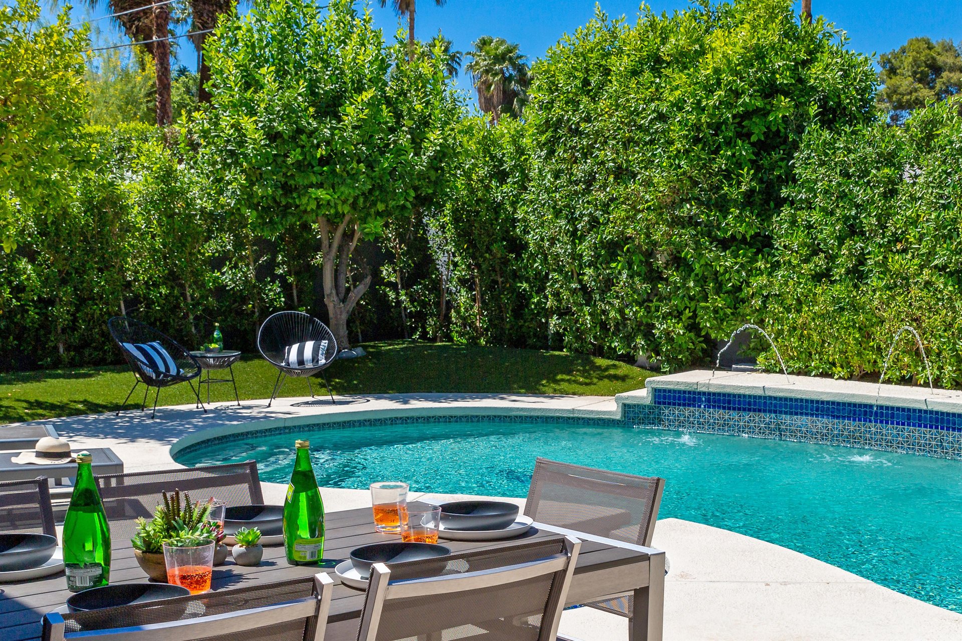 Enjoy a cocktail while relaxing poolside