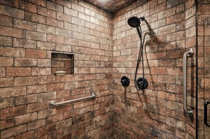Spacious walkin shower with rustic tile, handheld and rain shower heads, builtin shelf, and safety grab bars for your comfort.