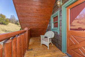 Wicker chair on a deck A Beary Nice Cabin, a 2 bedroom cabin rental located in Pigeon Forge