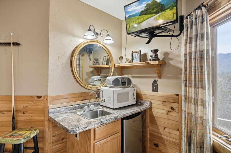 Your cozy mountain kitchenette combines rustic charm with modern convenience, featuring granite counters and scenic valley views.