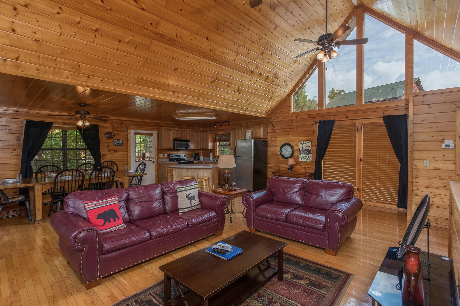 Sofa and loveseat in a living room Kick Back  Relax A 4 bedroom cabin rental located in Pigeon Forge