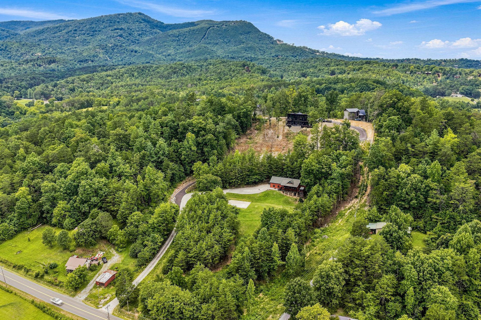 Nestled among lush forest and rolling mountains, the property offers peaceful seclusion in a stunning natural setting.
