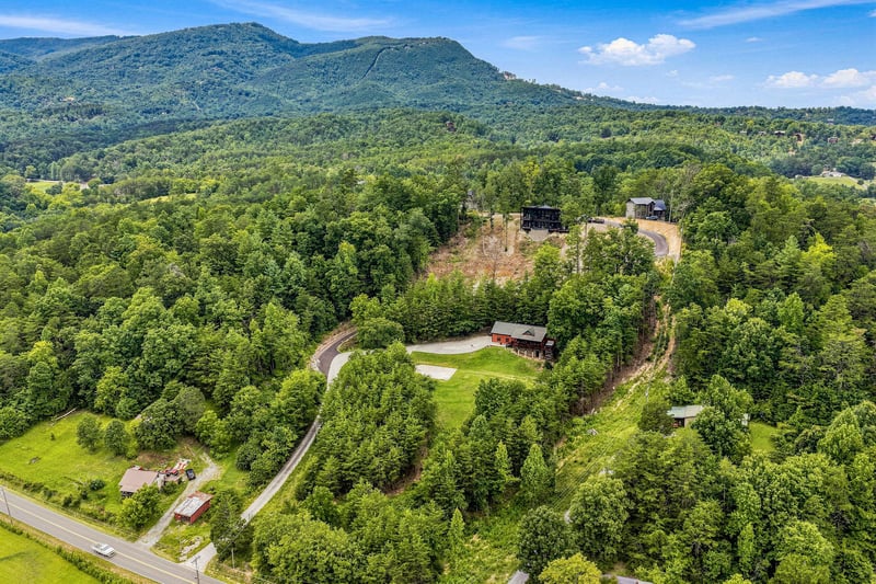 Nestled among lush forest and rolling mountains, the property offers peaceful seclusion in a stunning natural setting.