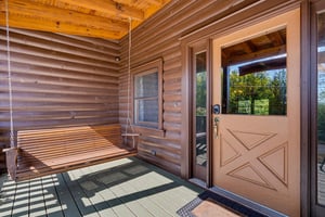 Arrive to your own private porch with a relaxing swing—perfect for your morning coffee or evening unwind.