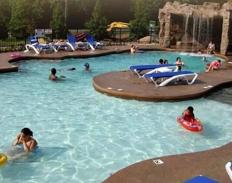 Dive into your private oasis where crystalclear water and cascading waterfall create the perfect backdrop for endless family fun.