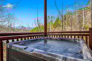 Soak in bubbling waters while mountain vistas unfold before you—your private hot tub offers the perfect blend of relaxation and scenic beauty.