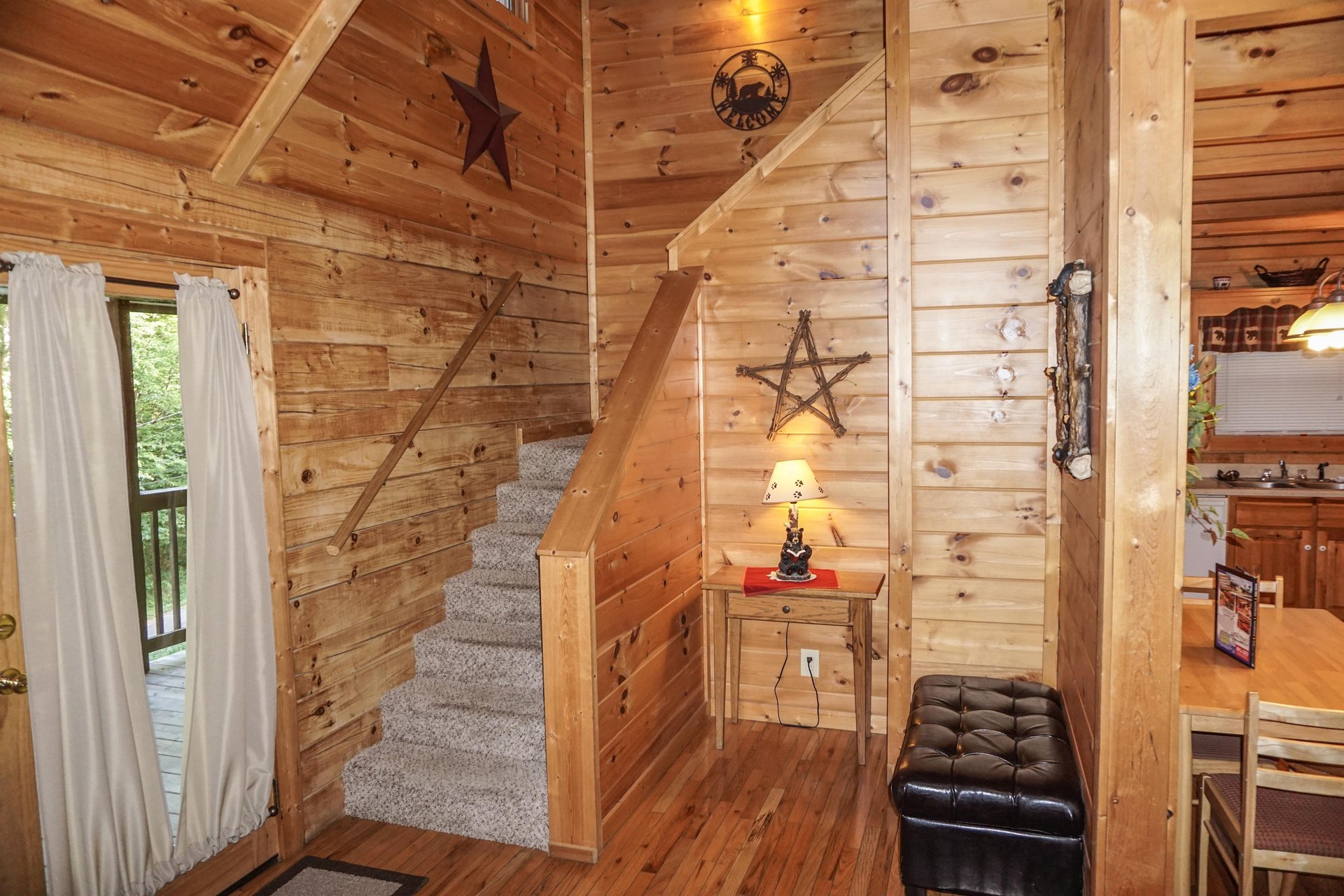 Staircase up to second floor at Bearly Mine, a 1bedroom cabin rental located in Pigeon Forge