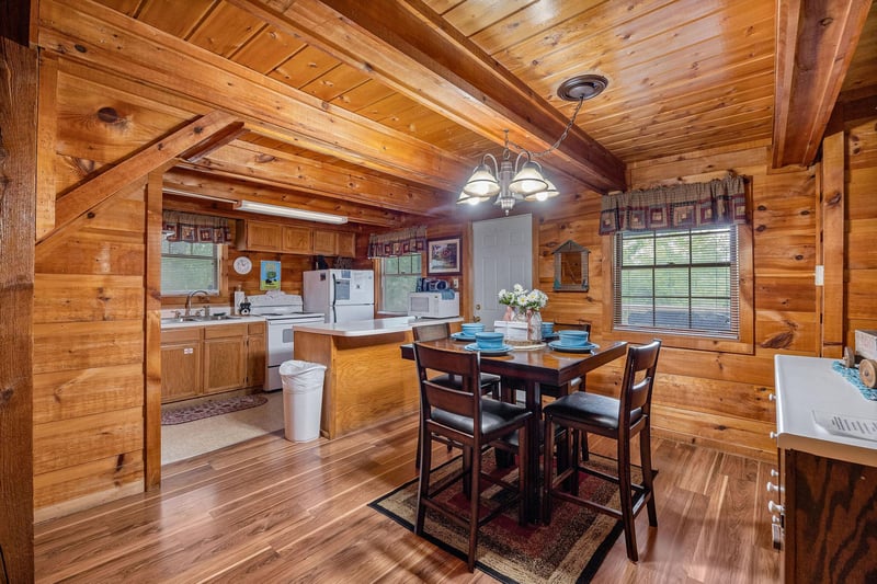 Dining table for four at Beary Good Time, a 1bedroom cabin rental located in Pigeon Forge