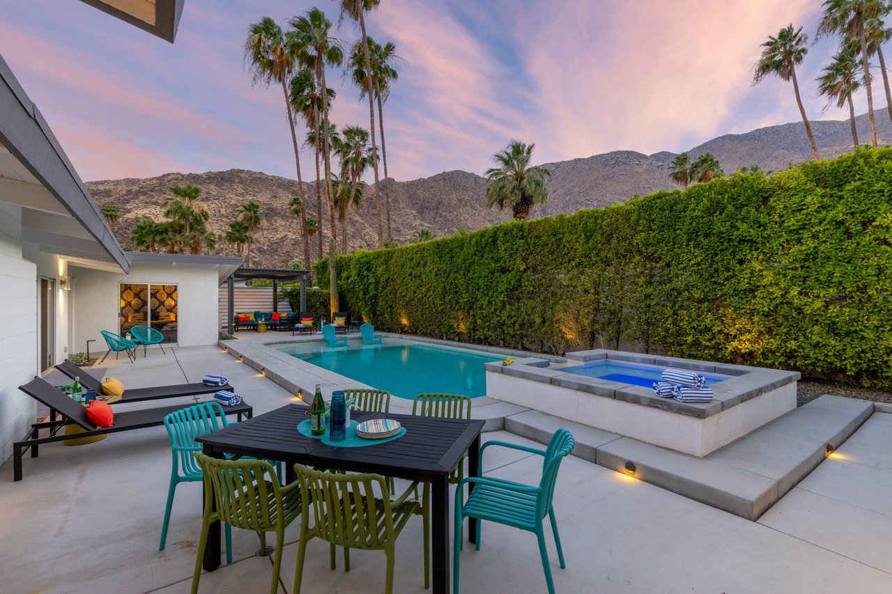 Private pool spa, outdoor seating, BBQ grill, and corn hole.