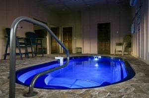 Slip into your own private hot tub, where soothing blue lights create the perfect ambiance for evening relaxation.