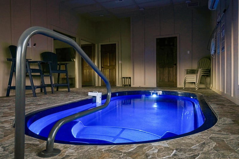 Slip into your own private hot tub, where soothing blue lights create the perfect ambiance for evening relaxation.