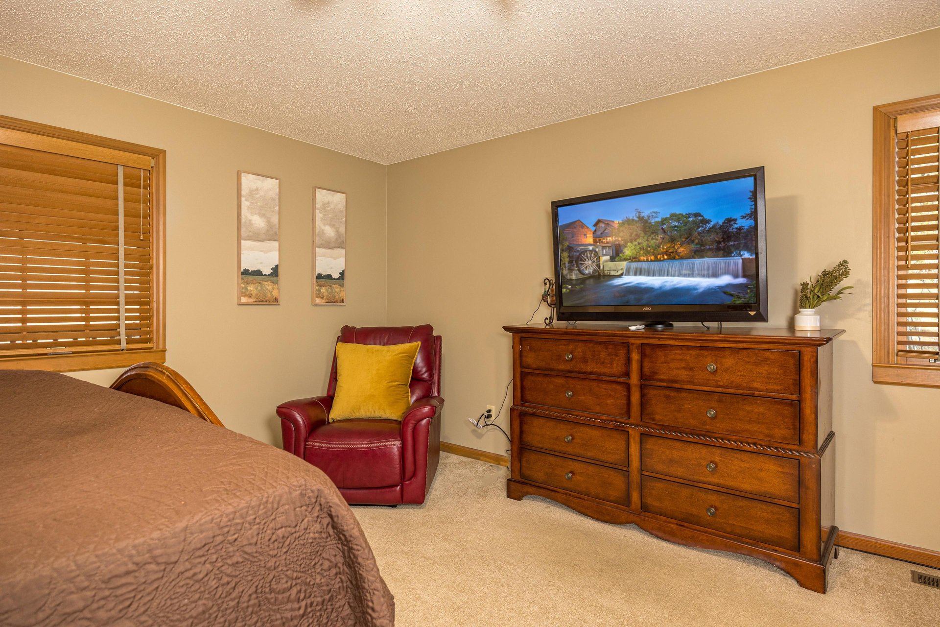 TV and recliner in entry level bedroom