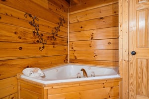 Slip into your private jetted tub, surrounded by warm knotted pine—this cozy corner is all yours for pure relaxation and unwinding after a day of adventure.