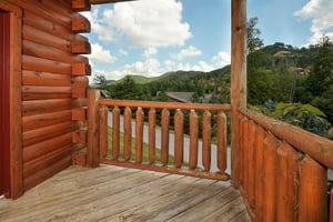 Looking out onto the road from the deck at Kick Back  Relax A 4 bedroom cabin rental located in Pigeon Forge
