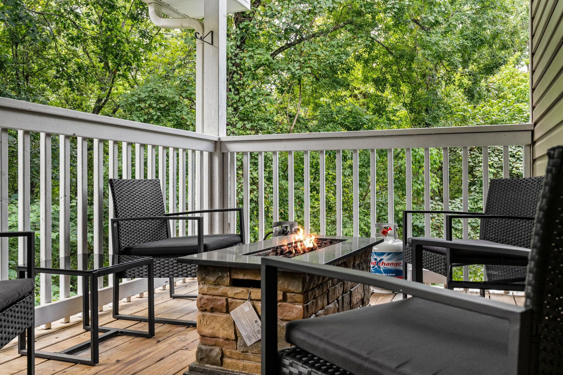Outdoor seating around stone fire pit table