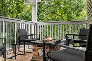 Outdoor seating around stone fire pit table