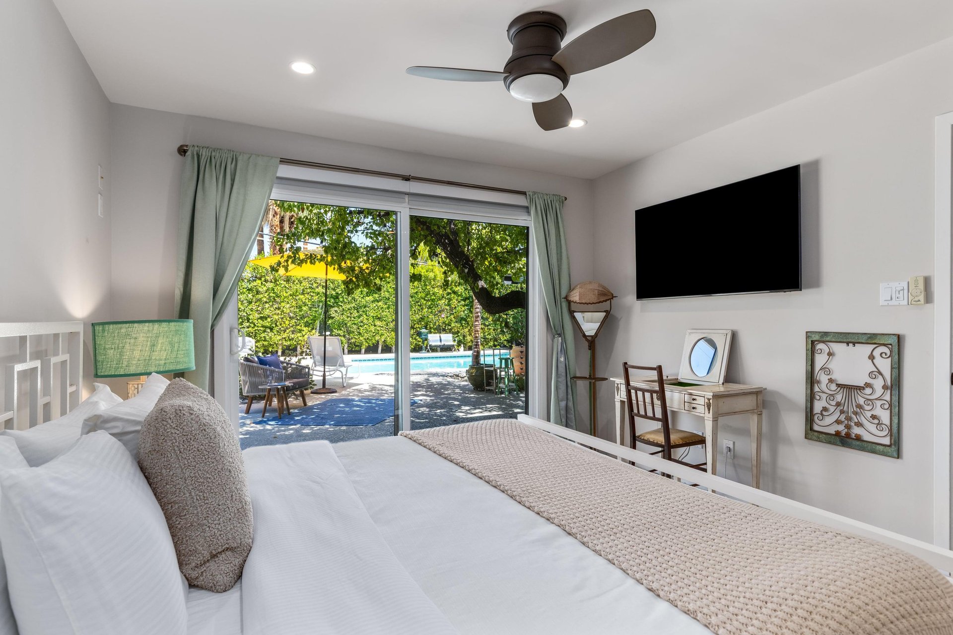 King bed, Smart TV, patio access, and ensuite bathroom.