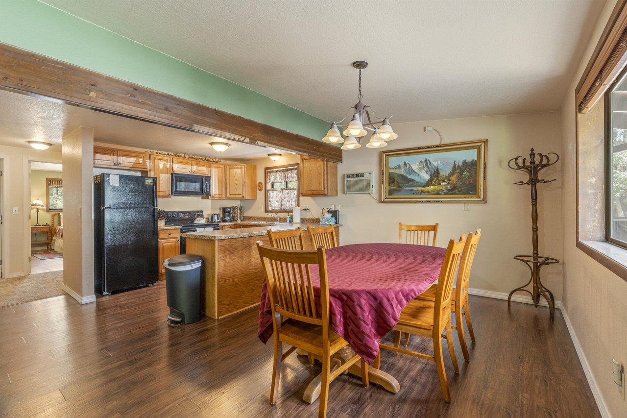 Dining table with chairs for 6 guests just off of the kitchen.