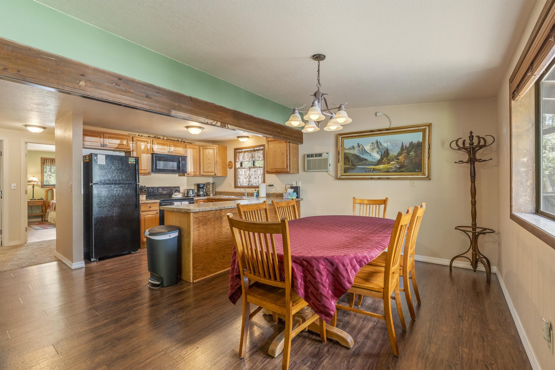 Dining table with chairs for 6 guests just off of the kitchen.