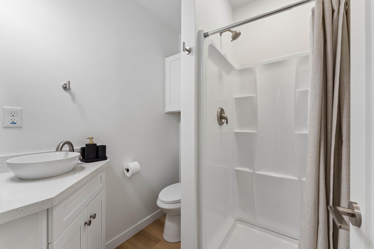 Guest Bathroom with modern finishes and stand alone shower.