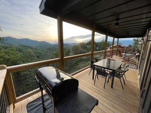 Deck grill and outdoor dining table and chairs