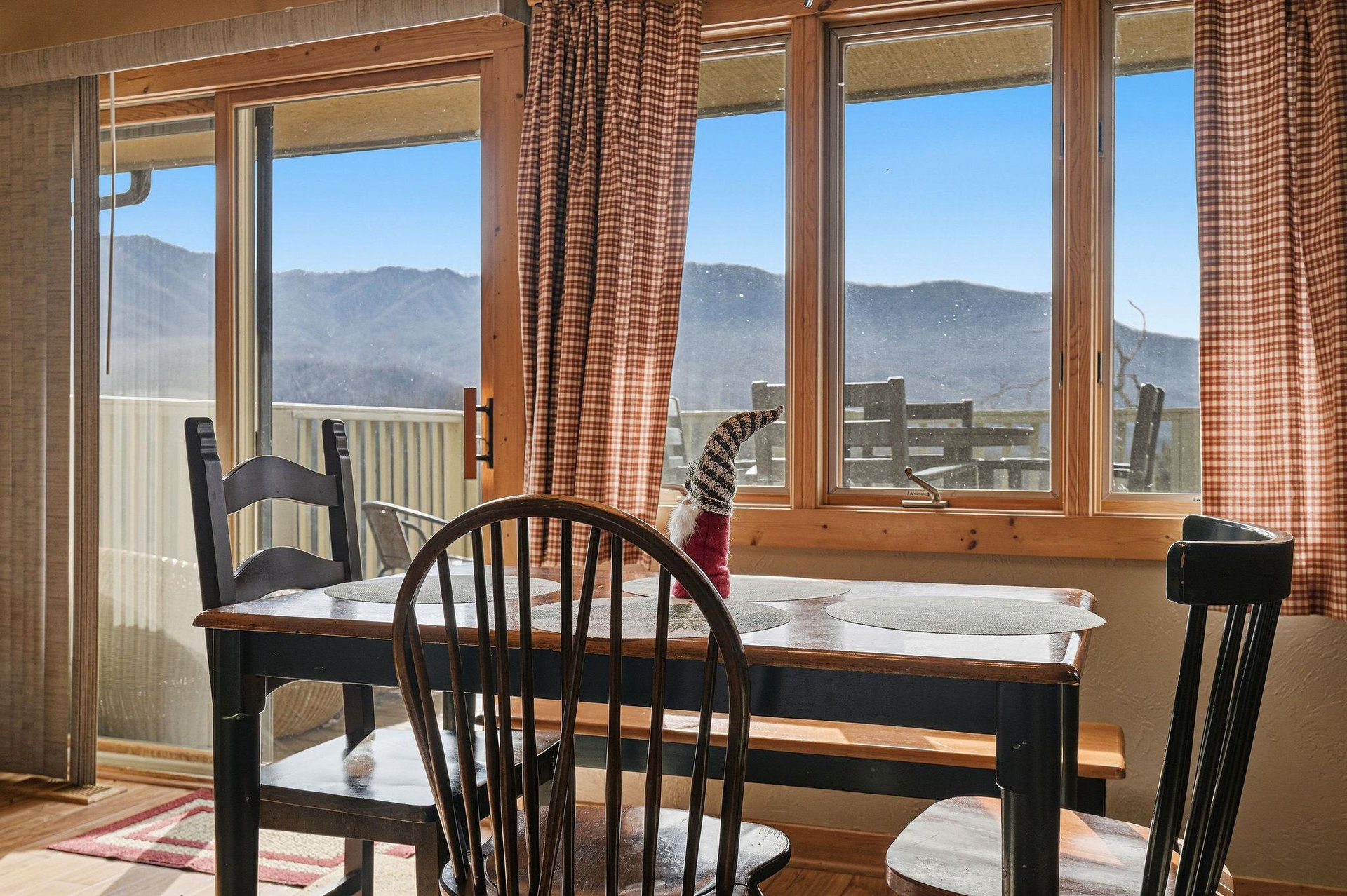 Enjoy breathtaking mountain views while sharing meals at your cozy dining table, with alpine peaks stretching endlessly beyond your windows.